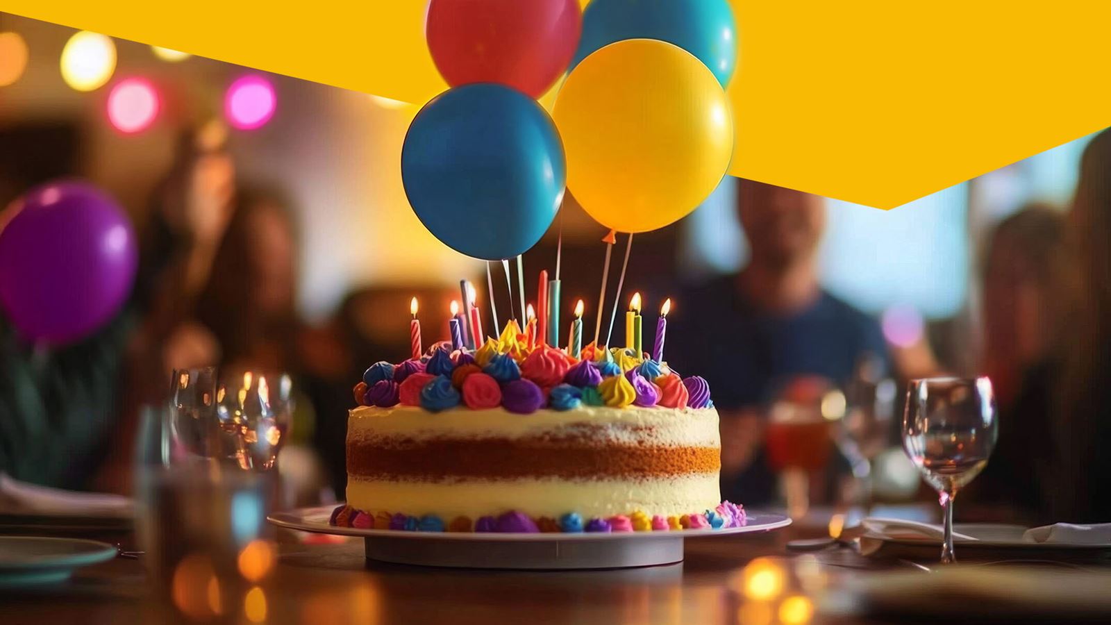 Birthday cake with candles and balloons (with yellow design element above)
